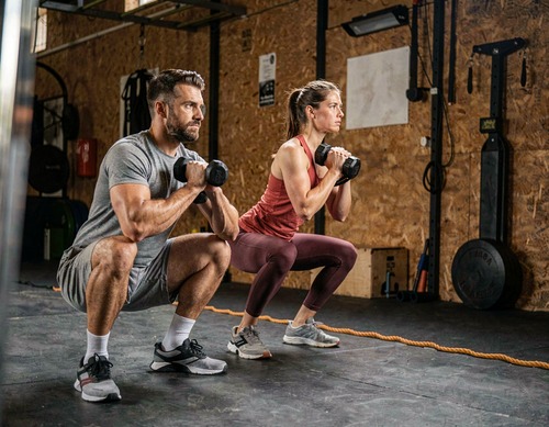 Couple Performing Goblet Squats