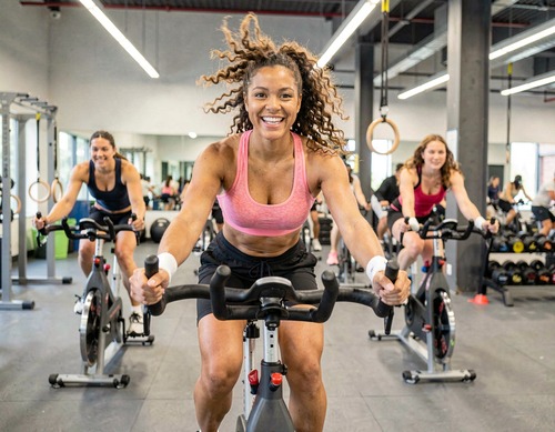 Woman Cycling in Gym