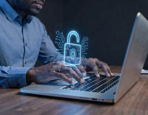 Cybersecurity Professional Using Laptop with Digital Lock