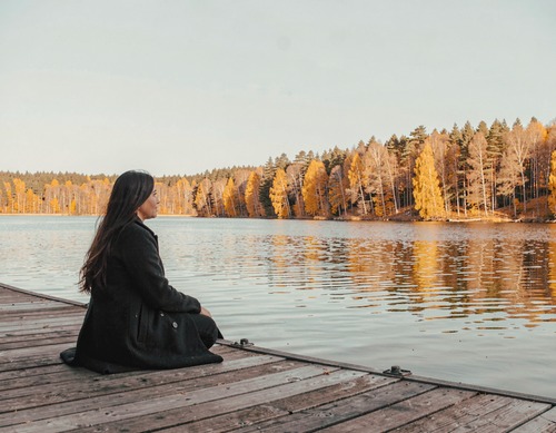 Woman on Autumn Pier
