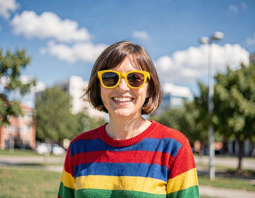 Happy Woman in Rainbow Sweater Outdoors