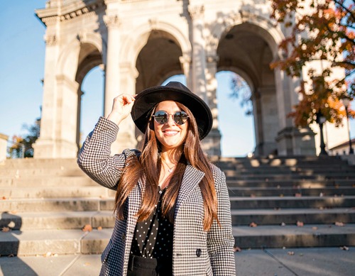 Stylish Woman in Hat by Monument
