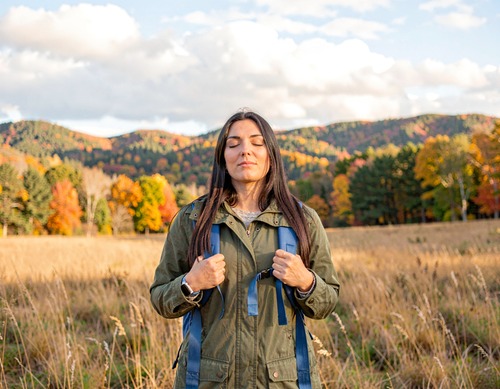 Woman Hiking in Autumn Landscape