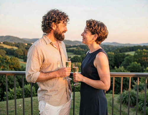 Sunset Couple Chatting on Balcony