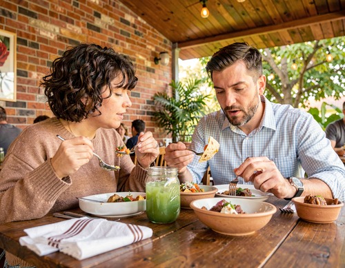 Happy Couple Sharing Tacos at Outdoor Restaurant