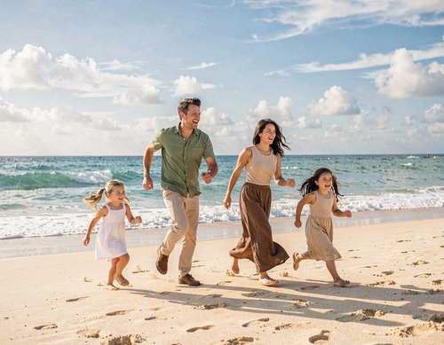 Happy Family Running on Beach
