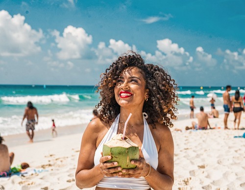 Beach Woman with Coconut Drink