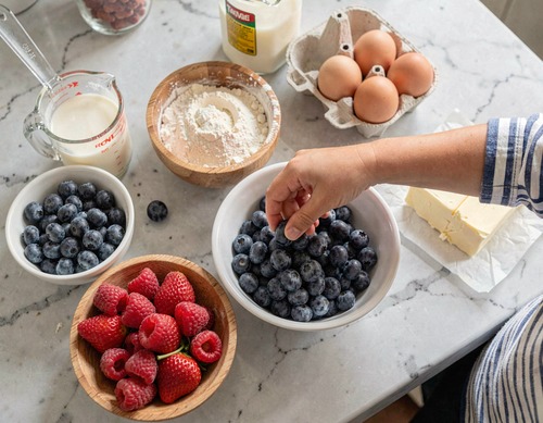Child Preparing Fresh Berry Breakfast