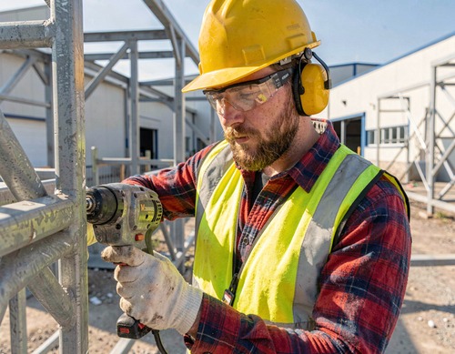 Construction Worker Using Power Drill