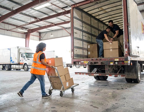 Warehouse Workers Loading Boxes