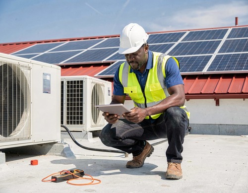 HVAC Technician Inspecting Equipment