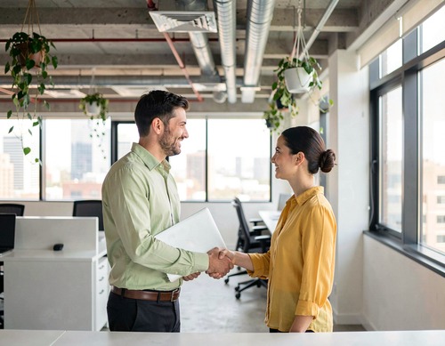 Business Handshake in Modern Office