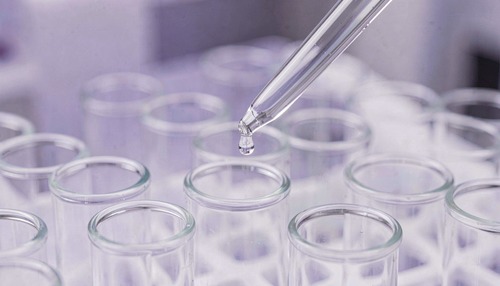 Lab Pipette Dropping Liquid into Test Tube