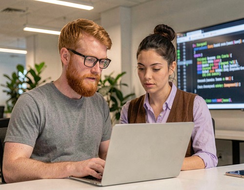 Developers Collaborating on Code