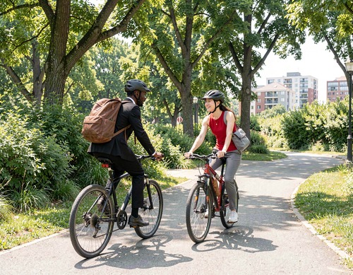 Two People Cycling in Park