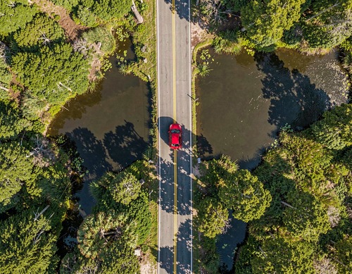 Aerial Road with Red Car and Nature
