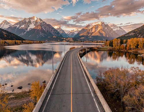 Sunset Bridge Over Lake Mountains