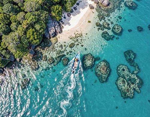 Aerial View of Boat on Turquoise Water