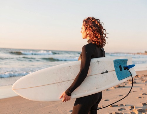 Surfer Woman on Sunset Beach