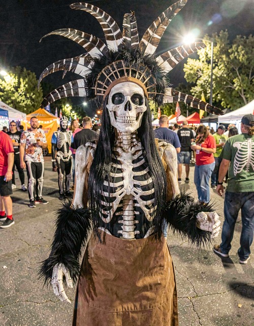 Skeleton Festival Performer with Feather Headdress