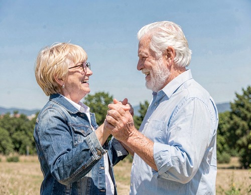 Elderly Couple Dancing in Nature