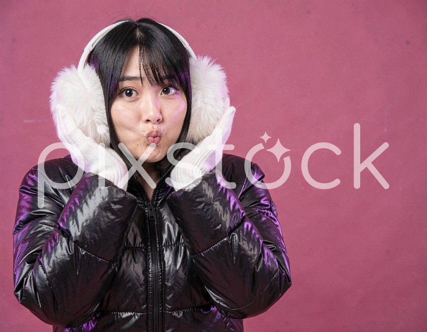 Asian Woman in Black Puffer on Hot Pink Background