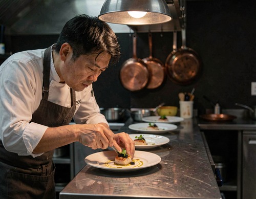 Chef Plating New Year’s Eve Tasting Menu