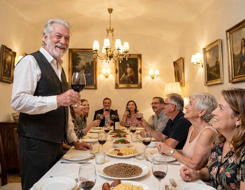Italian Grandfather Giving Toast at Head of Table