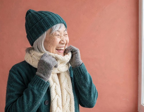 Laughing Senior Asian Woman in Teal Knit Hat