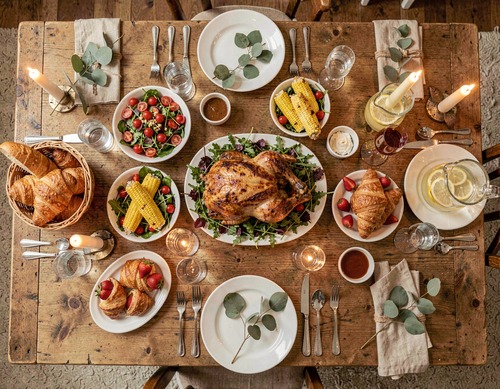Festive Table Spread with Roast Chicken and Fresh Dishes