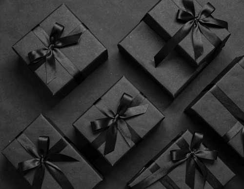 Black Gift Boxes with Ribbons on Dark Background