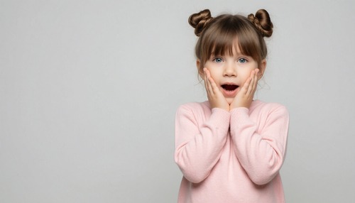 Surprised Girl with Hands on Cheeks Wearing a Pink Sweater
