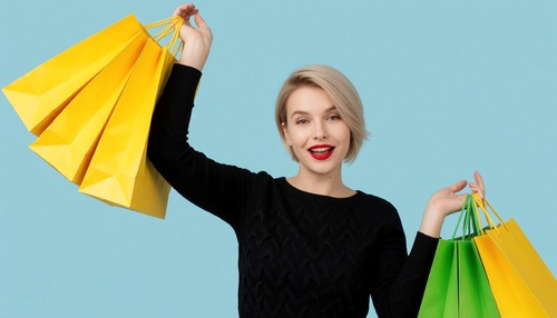 Smiling Woman Holding Yellow and Green Shopping Bags